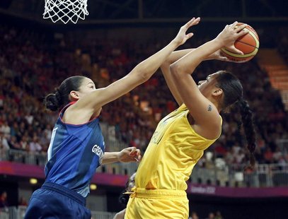 Great Britain's Azania Stewart (L) tries to block the shot of Australia's Liz Cambage during their women's Group B basketball match at the L Great Britain's Azania Stewart (L) tries to block the shot of Australia's Liz Cambage during their women's Group B basketball match at the L