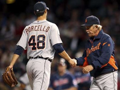 Detroit Tigers starting pitcher Rick Porcello, handing the ball to manager Jim Leyland. Porcello gave up five earned runs in six innings pitched, as the Tigers lost to the Blue Jays on July 27, 2012, in Toronto (REUTERS) Detroit Tigers starting pitcher Rick Porcello, handing the ball to manager Jim Leyland. Porcello gave up five earned runs in six innings pitched, as the Tigers lost to the Blue Jays on July 27, 2012, in Toronto (REUTERS)