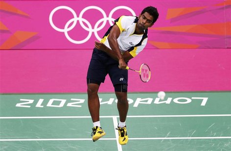 Mohamed Ajfan Rasheed of Maldives plays against Marc Zwiebler of Germany during the men's singles group play stage at the Wembley Arena duri Mohamed Ajfan Rasheed of Maldives plays against Marc Zwiebler of Germany during the men's singles group play stage at the Wembley Arena duri