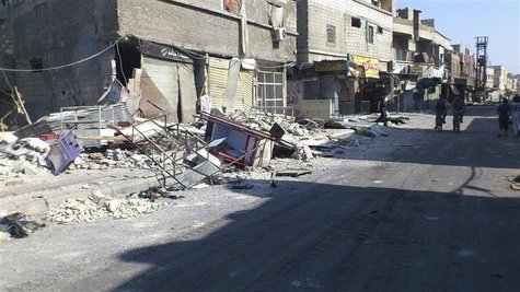 Damaged buildings are seen at Al-Assali neighbourhood in Damascus July 28, 2012. REUTERS/Shaam News Network/Handout Damaged buildings are seen at Al-Assali neighbourhood in Damascus July 28, 2012. REUTERS/Shaam News Network/Handout