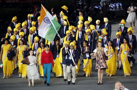 India's flag bearer Sushil Kumar holds the national flag as he leads the contingent in the athletes parade during the opening ceremony of th India's flag bearer Sushil Kumar holds the national flag as he leads the contingent in the athletes parade during the opening ceremony of th