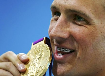 Ryan Lochte of the U.S. holds his gold medal after winning the men's 400m individual medley during the London 2012 Olympic Games at the Aqua Ryan Lochte of the U.S. holds his gold medal after winning the men's 400m individual medley during the London 2012 Olympic Games at the Aqua
