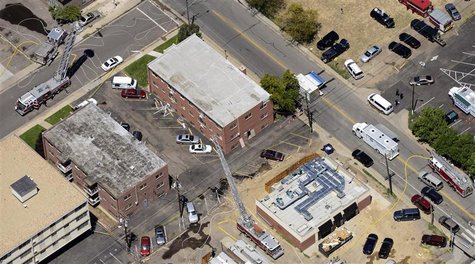 The apartment of James Holmes (top) is shown surrounded by police and firefighters in Aurora, Colorado July 20, 2012, following a shooting a The apartment of James Holmes (top) is shown surrounded by police and firefighters in Aurora, Colorado July 20, 2012, following a shooting a