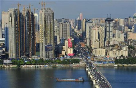 A general view of buildings is seen near the Xiangjiang River in Changsha, Hunan province July 25, 2012. REUTERS/China Daily A general view of buildings is seen near the Xiangjiang River in Changsha, Hunan province July 25, 2012. REUTERS/China Daily