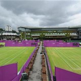 Outside courts are surrounded with Olympic hoarding at the All England Lawn Tennis Club (AELTC) as preparations are made for the London 2012