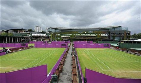 Outside courts are surrounded with Olympic hoarding at the All England Lawn Tennis Club (AELTC) as preparations are made for the London 2012 Outside courts are surrounded with Olympic hoarding at the All England Lawn Tennis Club (AELTC) as preparations are made for the London 2012
