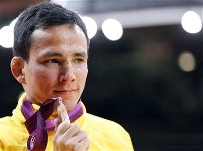 Brazil's Felipe Kitadai celebrates with his bronze B medal after the awards ceremony for the men's -60kg final judo match, at the London 201 Brazil's Felipe Kitadai celebrates with his bronze B medal after the awards ceremony for the men's -60kg final judo match, at the London 201