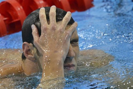 Michael Phelps of the U.S. reacts after taking third place in his men's 200m butterfly heat at the London 2012 Olympic Games at the Aquatics Michael Phelps of the U.S. reacts after taking third place in his men's 200m butterfly heat at the London 2012 Olympic Games at the Aquatics