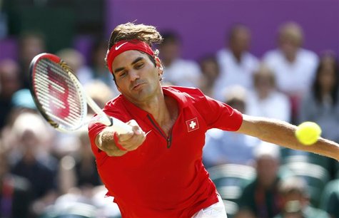 Switzerland's Roger Federer stretches for a return to France's Julien Benneteau in their men's singles tennis match at the All England Lawn Switzerland's Roger Federer stretches for a return to France's Julien Benneteau in their men's singles tennis match at the All England Lawn