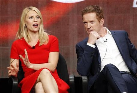 Cast member Claire Danes speaks, as co-star Damian Lewis watches, at a panel for "Homeland" during the Showtime television portion of the Te Cast member Claire Danes speaks, as co-star Damian Lewis watches, at a panel for "Homeland" during the Showtime television portion of the Te