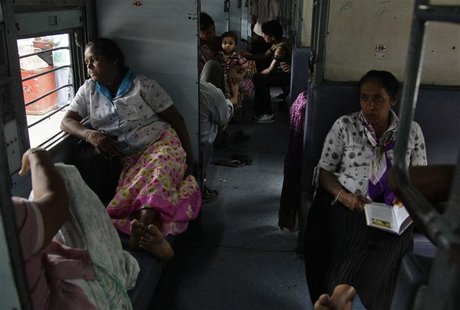 Passengers sit in a train as they wait for electricity to be restored at a railway station in the northern Indian city of Allahabad July 30, Passengers sit in a train as they wait for electricity to be restored at a railway station in the northern Indian city of Allahabad July 30,