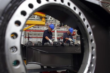 Employees work at a Sany assembly plant in Lingang Industrial Park, near Shanghai June 28, 2012. REUTERS/Carlos Barria Employees work at a Sany assembly plant in Lingang Industrial Park, near Shanghai June 28, 2012. REUTERS/Carlos Barria