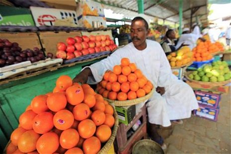 A vegetable vendor waits for customers at his shop in Khartoum, Sudan May 12, 2011. REUTERS /Mohamed Nureldin Abdallah A vegetable vendor waits for customers at his shop in Khartoum, Sudan May 12, 2011. REUTERS /Mohamed Nureldin Abdallah