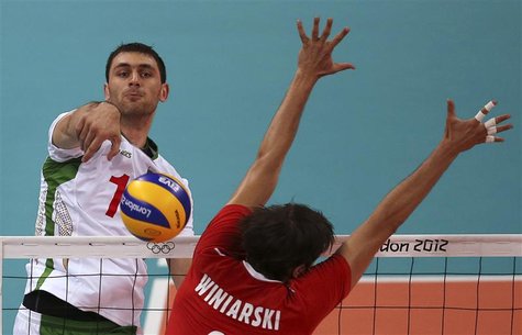 Bulgaria's Tsvetan Sokolov (L) spikes the ball against Poland's Michal Winiarski during their men's Group A volleyball match at the London 2 Bulgaria's Tsvetan Sokolov (L) spikes the ball against Poland's Michal Winiarski during their men's Group A volleyball match at the London 2