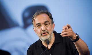 Fiat-Chrysler chief executive Sergio Marchionne gestures during the official presentation of the new Fiat 500L car in downtown Turin July 3, Fiat-Chrysler chief executive Sergio Marchionne gestures during the official presentation of the new Fiat 500L car in downtown Turin July 3,