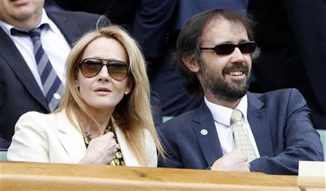 Author J.K. Rowling and her husband Neil Murray sit on Centre Court at the Wimbledon tennis championships in London June 26, 2012. REUTERS/S Author J.K. Rowling and her husband Neil Murray sit on Centre Court at the Wimbledon tennis championships in London June 26, 2012. REUTERS/S