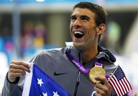 Michael Phelps of the U.S. holds his 19th Olympic medal presented to him in the men's 4x200m freestyle relay victory ceremony during the Lon Michael Phelps of the U.S. holds his 19th Olympic medal presented to him in the men's 4x200m freestyle relay victory ceremony during the Lon