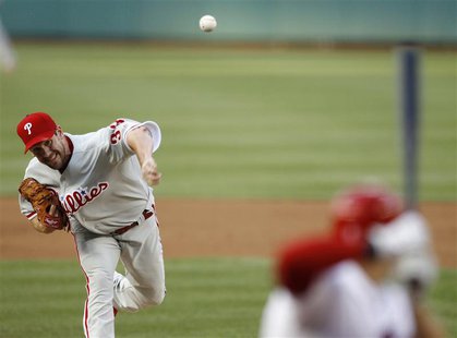 Philadelphia Phillies starting pitcher Cliff Lee pitches against the Washington Nationals in the first inning of their MLB baseball game in Philadelphia Phillies starting pitcher Cliff Lee pitches against the Washington Nationals in the first inning of their MLB baseball game in