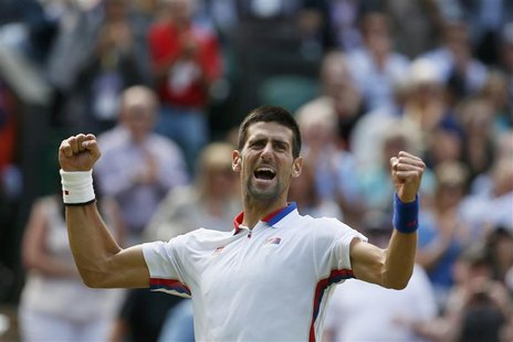 Serbia's Novak Djokovic celebrates after defeating France's Jo-Wilfried Tsonga in their men's singles quarterfinals tennis match at the All Serbia's Novak Djokovic celebrates after defeating France's Jo-Wilfried Tsonga in their men's singles quarterfinals tennis match at the All