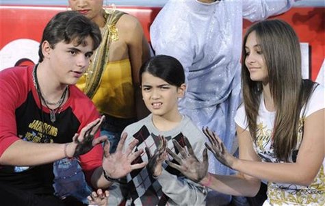 Singer Michael Jackson is immortalized in a ceremony where his children (L-R) Prince, Blanket and Paris use Jackson's shoes and gloves and t Singer Michael Jackson is immortalized in a ceremony where his children (L-R) Prince, Blanket and Paris use Jackson's shoes and gloves and t