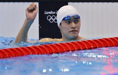China's Sun Yang celebrates his first place finish in heat 4 of the men's 1500m freestyle event during the London 2012 Olympic Games at the China's Sun Yang celebrates his first place finish in heat 4 of the men's 1500m freestyle event during the London 2012 Olympic Games at the