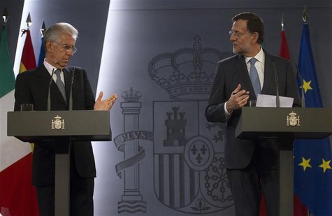 Spain's Prime Minister Mariano Rajoy (R) and Italy's Prime Minister Mario Monti attend a news conference at the Moncloa Palace in Madrid Aug Spain's Prime Minister Mariano Rajoy (R) and Italy's Prime Minister Mario Monti attend a news conference at the Moncloa Palace in Madrid Aug