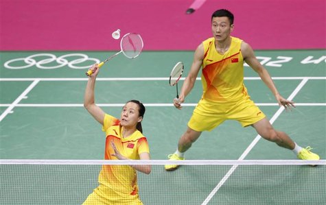 China's Zhao Yunlei (L) and Zhang Nan play against compatriots Xu Chen and Ma Jin during their mixed doubles badminton gold medal match duri China's Zhao Yunlei (L) and Zhang Nan play against compatriots Xu Chen and Ma Jin during their mixed doubles badminton gold medal match duri