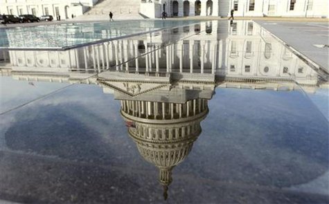The dome of the Capitol is reflected in a puddle in Washington February 17, 2012. REUTERS/Kevin Lamarque The dome of the Capitol is reflected in a puddle in Washington February 17, 2012. REUTERS/Kevin Lamarque