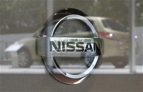 Nissan Motor Corp's logo is pictured as a Nissan vehicle is reflected on glass at the Nissan Gallery in Yokohama, south of Tokyo July 26, 20 Nissan Motor Corp's logo is pictured as a Nissan vehicle is reflected on glass at the Nissan Gallery in Yokohama, south of Tokyo July 26, 20
