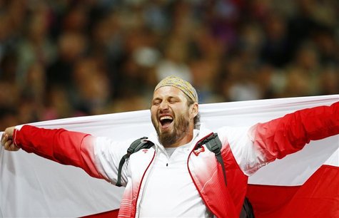Poland's Tomasz Majewski celebrates winning gold in the men's shot put final at the London 2012 Olympic Games at the Olympic Stadium August Poland's Tomasz Majewski celebrates winning gold in the men's shot put final at the London 2012 Olympic Games at the Olympic Stadium August