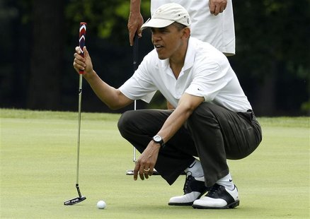 President Barack Obama lines up a putt on the first green at Andrews Air Force Base in Maryland, June 18, 2011. REUTERS/Larry Downing President Barack Obama lines up a putt on the first green at Andrews Air Force Base in Maryland, June 18, 2011. REUTERS/Larry Downing