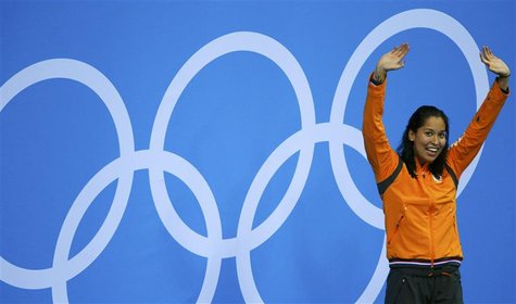 Netherlands' Ranomi Kromowidjojo celebrates with her gold medal during the women's 50m freestyle victory ceremony at the London 2012 Olympic Netherlands' Ranomi Kromowidjojo celebrates with her gold medal during the women's 50m freestyle victory ceremony at the London 2012 Olympic