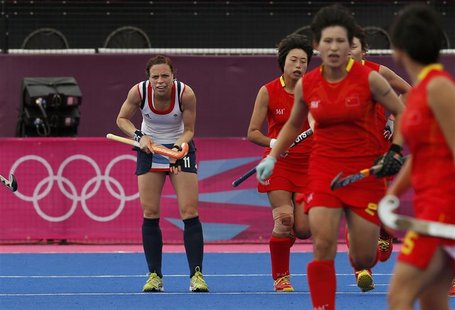 Britain's Kate Walsh stands near China's players during their women's Group A hockey match at the London 2012 Olympic Games at the Riverbank Britain's Kate Walsh stands near China's players during their women's Group A hockey match at the London 2012 Olympic Games at the Riverbank