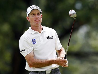 Jim Furyk of the U.S. watches his tee shot on the 14th hole during the third round of the WGC-Bridgestone Invitational golf tournament in Ak Jim Furyk of the U.S. watches his tee shot on the 14th hole during the third round of the WGC-Bridgestone Invitational golf tournament in Ak