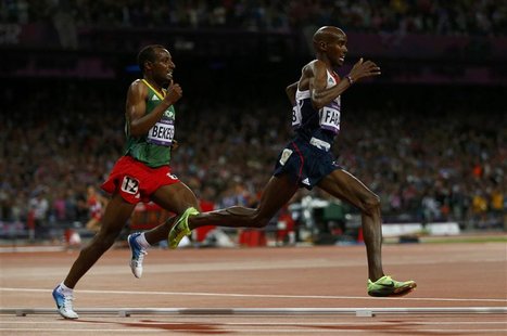 Britain's Mo Farah (R) runs through the final turn with Ethiopia's Tariku Bekele during the men's 10,000m final at the London 2012 Olympic G Britain's Mo Farah (R) runs through the final turn with Ethiopia's Tariku Bekele during the men's 10,000m final at the London 2012 Olympic G
