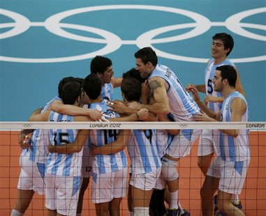 Argentina's players celebrate victory against Bulgaria after their men's Group A volleyball match at Earls Court during the London 2012 Olym Argentina's players celebrate victory against Bulgaria after their men's Group A volleyball match at Earls Court during the London 2012 Olym