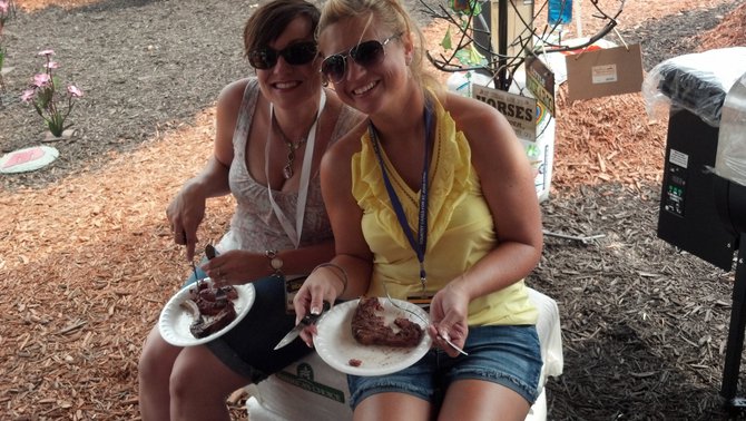 Nikki & Vanessa enjoying steak cooked by American Wood Fibers with their grill pellets.