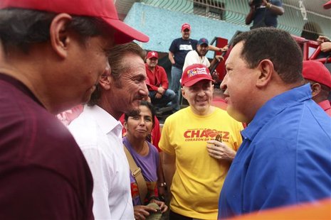 Venezuela's President Hugo Chavez (R) talks to U.S. actor Sean Penn during an election rally in Valencia, some 150 km (93 miles) west from C Venezuela's President Hugo Chavez (R) talks to U.S. actor Sean Penn during an election rally in Valencia, some 150 km (93 miles) west from C
