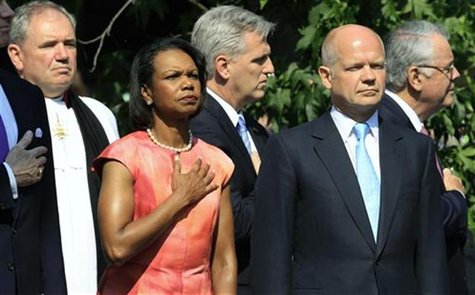 Former U.S. Secretary of State Condoleezza Rice (2nd L) and Britain's Foreign Secretary William Hague (2nd R) listen to the U.S. national an Former U.S. Secretary of State Condoleezza Rice (2nd L) and Britain's Foreign Secretary William Hague (2nd R) listen to the U.S. national an