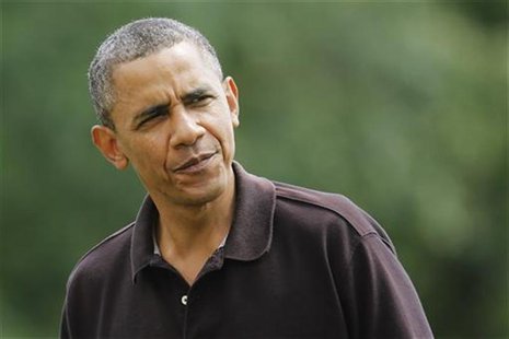 President Barack Obama looks at reporters as he returns from a birthday visit at Camp David, to the White House in Washington, August 5, 201 President Barack Obama looks at reporters as he returns from a birthday visit at Camp David, to the White House in Washington, August 5, 201