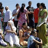 Members of the Sikh Temple wait for news following a mass shooting that left seven persons dead including the shooter in Oak Creek, Wisconsin August 5, 2012. REUTERS/Allen Fredrickson