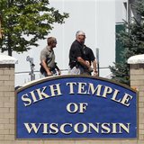 Officials gather near the Sikh Temple in Oak Creek, Wisconsin after a gunman killed six people on Sunday. Officials gather near the Sikh Temple in Oak Creek, Wisconsin after a gunman killed six people on Sunday.