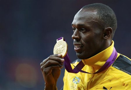 Jamaica's Usain Bolt holds his gold medal during the men's 100m victory ceremony during the London 2012 Olympic Games at the Olympic Stadium Jamaica's Usain Bolt holds his gold medal during the men's 100m victory ceremony during the London 2012 Olympic Games at the Olympic Stadium
