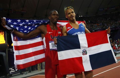 Dominican Republic's Felix Sanchez (R), who won gold, and second placed Michael Tinsley of the U.S. pose with their national flags after the Dominican Republic's Felix Sanchez (R), who won gold, and second placed Michael Tinsley of the U.S. pose with their national flags after the