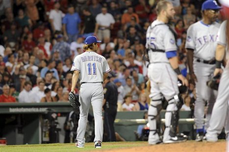 Texas Rangers pitcher Yu Darvish takes the walk to the bench after being pulled in the seventh inning of their American League game against Texas Rangers pitcher Yu Darvish takes the walk to the bench after being pulled in the seventh inning of their American League game against