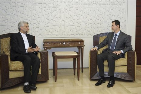 Syria's President Bashar al-Assad (R) meets Iran's Supreme National Security Council secretary Saeed Jalili in Damascus August 7, 2012, in t Syria's President Bashar al-Assad (R) meets Iran's Supreme National Security Council secretary Saeed Jalili in Damascus August 7, 2012, in t