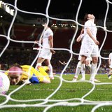 Canada's goalkeeper Erin McLeod (L) looks at the ball shot by USA's Alex Morgan (R, background) to win the women's semi final soccer match a