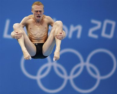Russia's Ilya Zakharov performs a dive during the men's 3m springboard preliminary round at the London 2012 Olympic Games at the Aquatics Ce Russia's Ilya Zakharov performs a dive during the men's 3m springboard preliminary round at the London 2012 Olympic Games at the Aquatics Ce