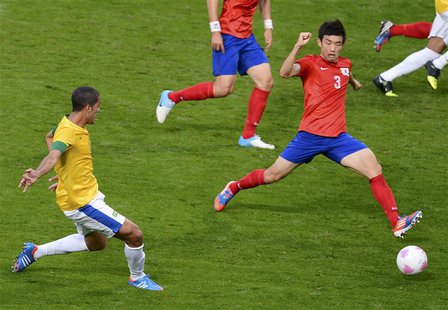 Brazil's Romulo (L) scores a goal past South Korea's Yun Suk-young during their men's semi-final soccer match at the London 2012 Olympic Gam Brazil's Romulo (L) scores a goal past South Korea's Yun Suk-young during their men's semi-final soccer match at the London 2012 Olympic Gam