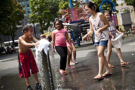 Children play at a fountain on an especially hot day in New York August 3, 2012. REUTERS/Andrew Burton Children play at a fountain on an especially hot day in New York August 3, 2012. REUTERS/Andrew Burton
